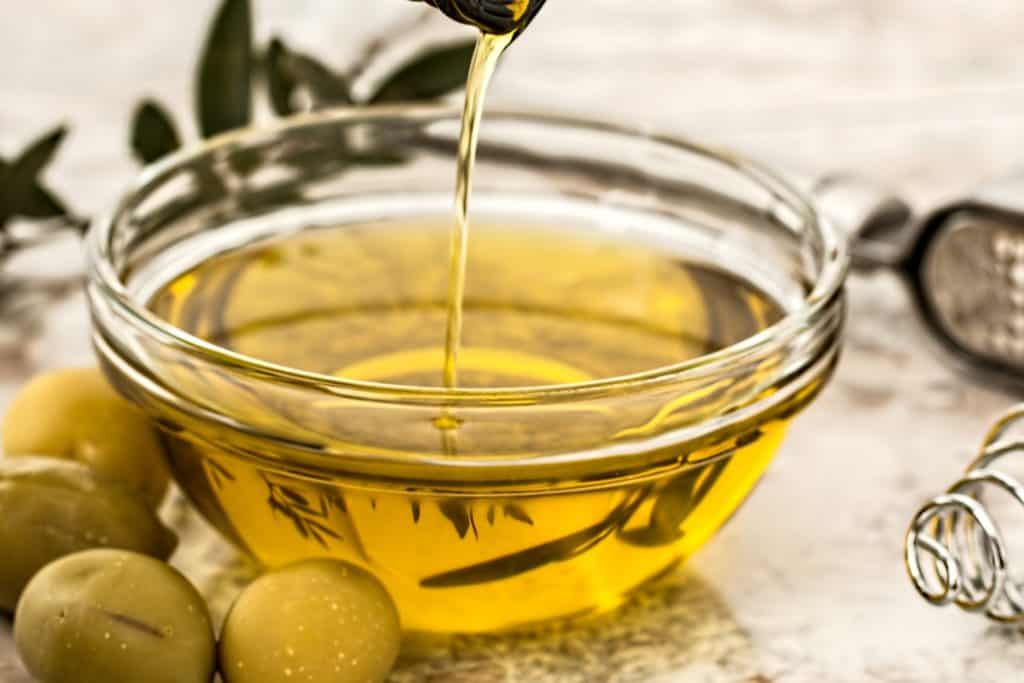 light green bowl of olive oil