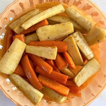 orange bowl with honey roasted carrots and parsnips