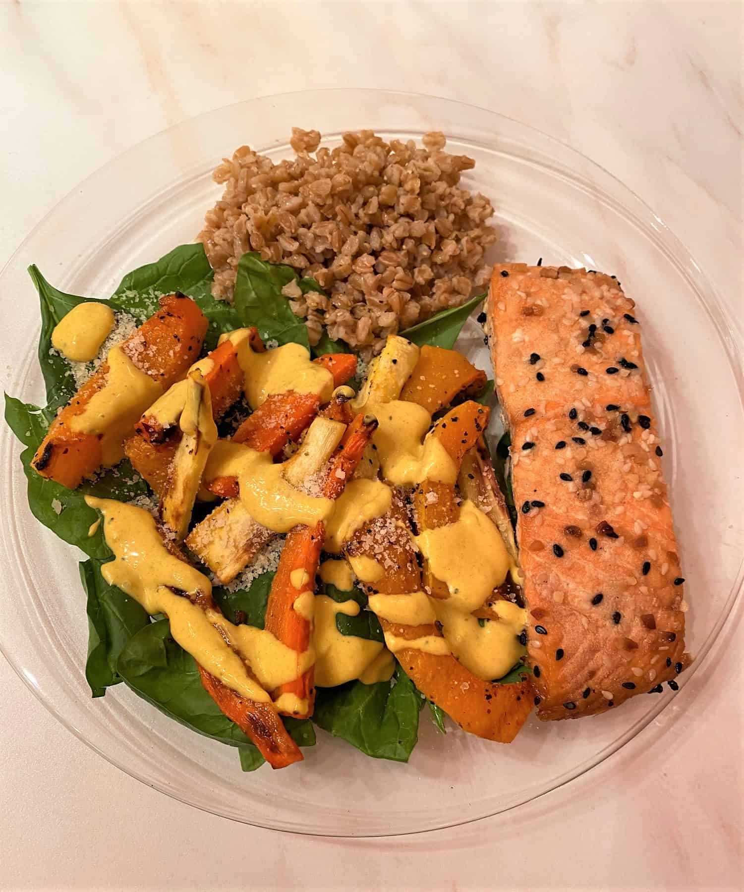Spinach Salad with Salmon, Roasted Root Veggies, and Turmeric Dressing