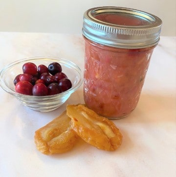 jar of chutney with dried pears and cwhole cranberries