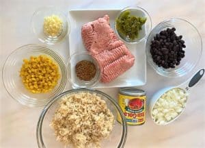 Raw ground turkey and other ingredients for Southwestern Stuffed Pepper Boats