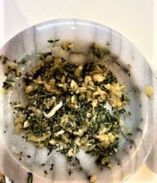 marble mortar with herb-garlic mash