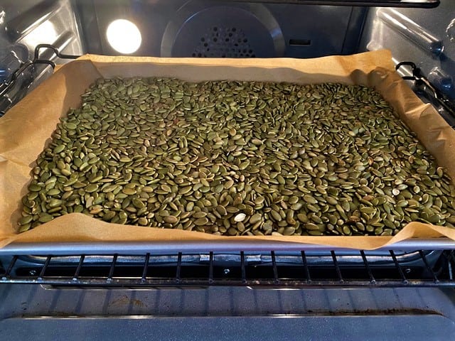 Pumpkin seeds roasting in the oven