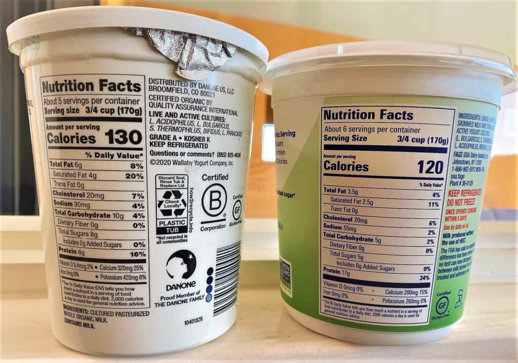 nutrition labels on cartons of plain Greek and regular yogurts