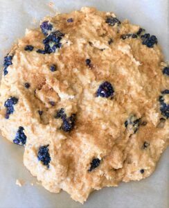 Unbaked Blackberry Scone on parchment