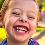 Young boy with huge smile