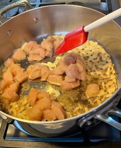 Browning chicken in the skillet for Creamy Coconut Chicken Curry