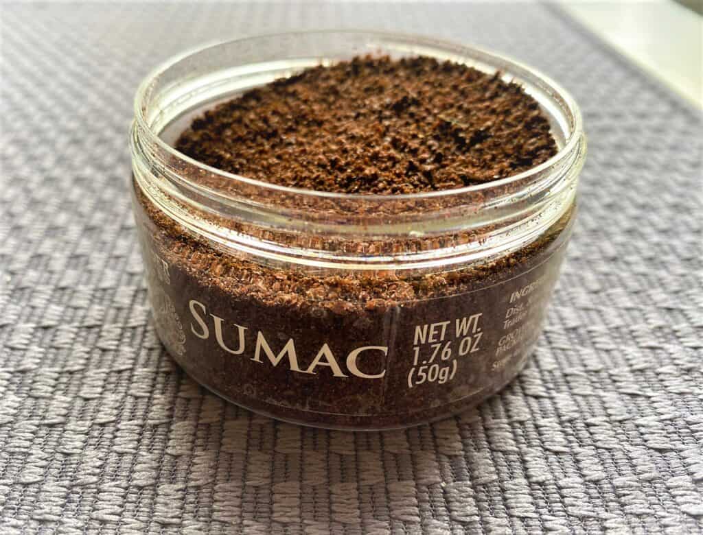 open jar of sumac dry spice for Sumac Tahini Drizzle