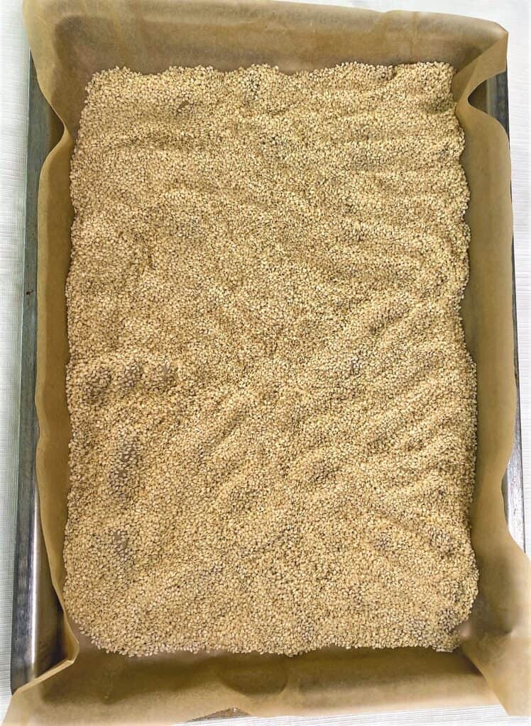 sesame seeds on parchment for tahini