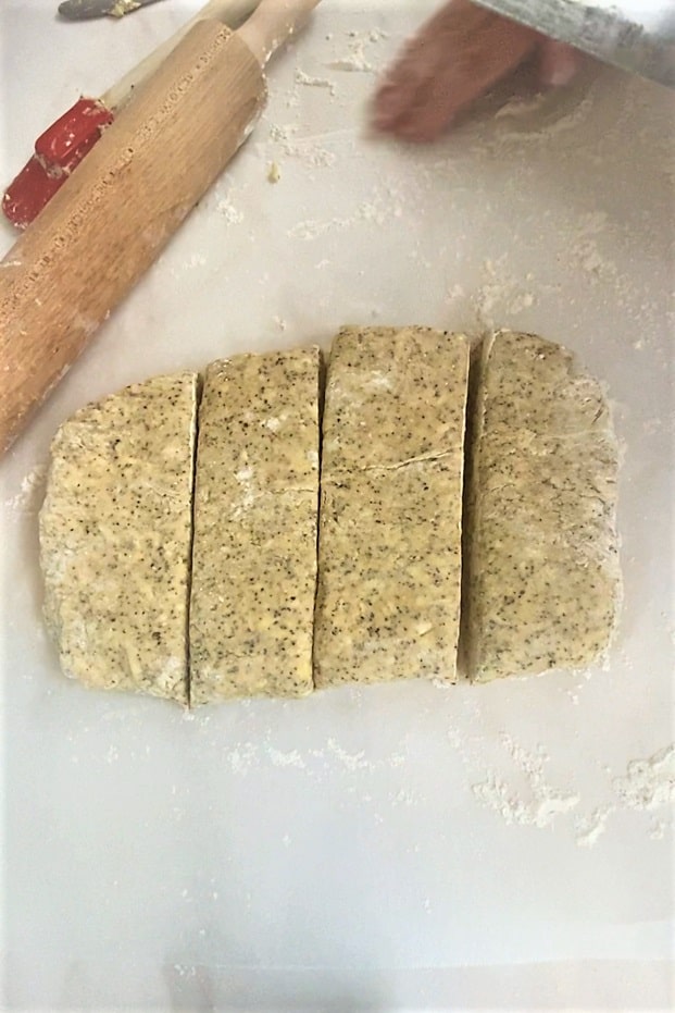 Rectangle-shaped Earl Grey scone dough cut into 4 pieces