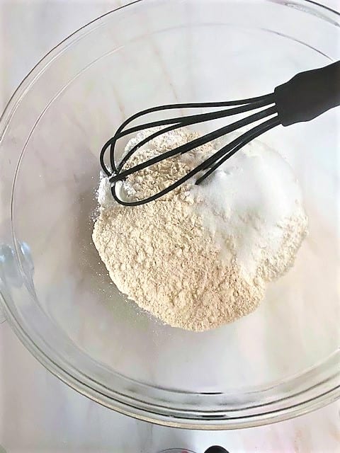 Dry scone ingredients with black whisk