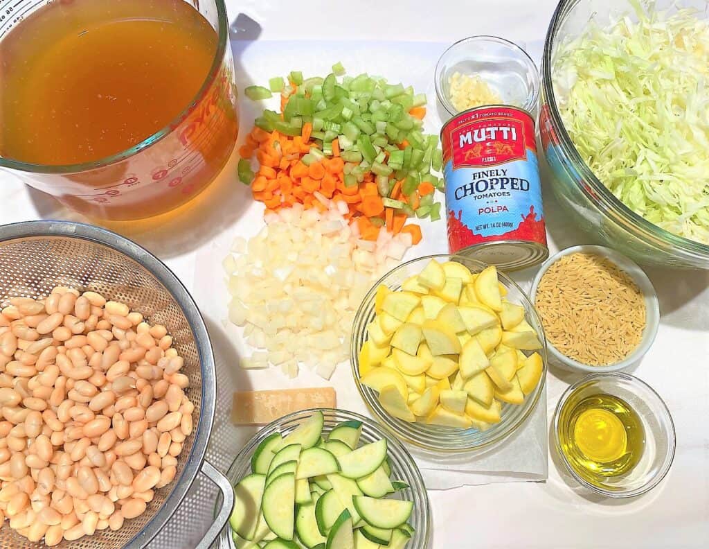 Minestrone di Verdure ingredients including beans, cabbage, broth, onion, etc