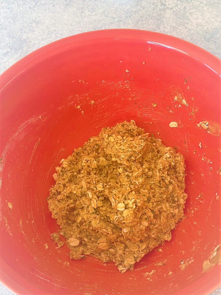 Red bowl with dough for Banana Dog Treats With Peanut Butter