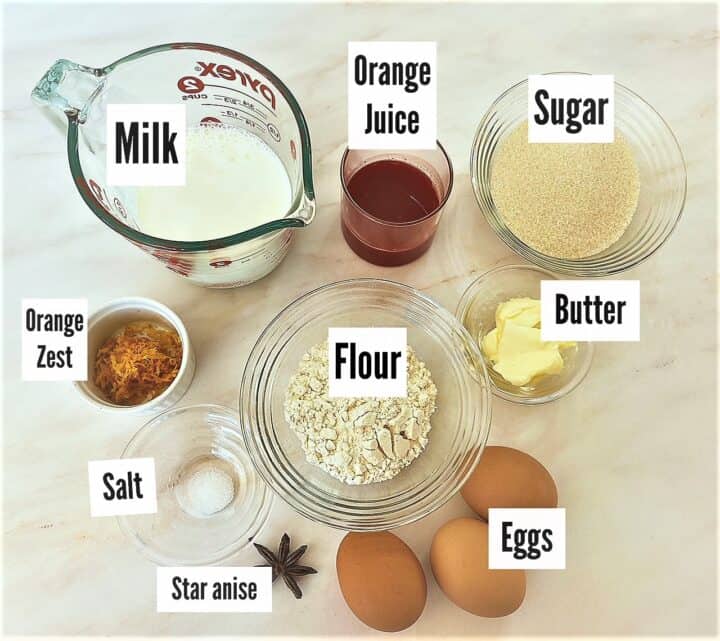 Ingredients for orange pudding cakes with star anise shown with labels