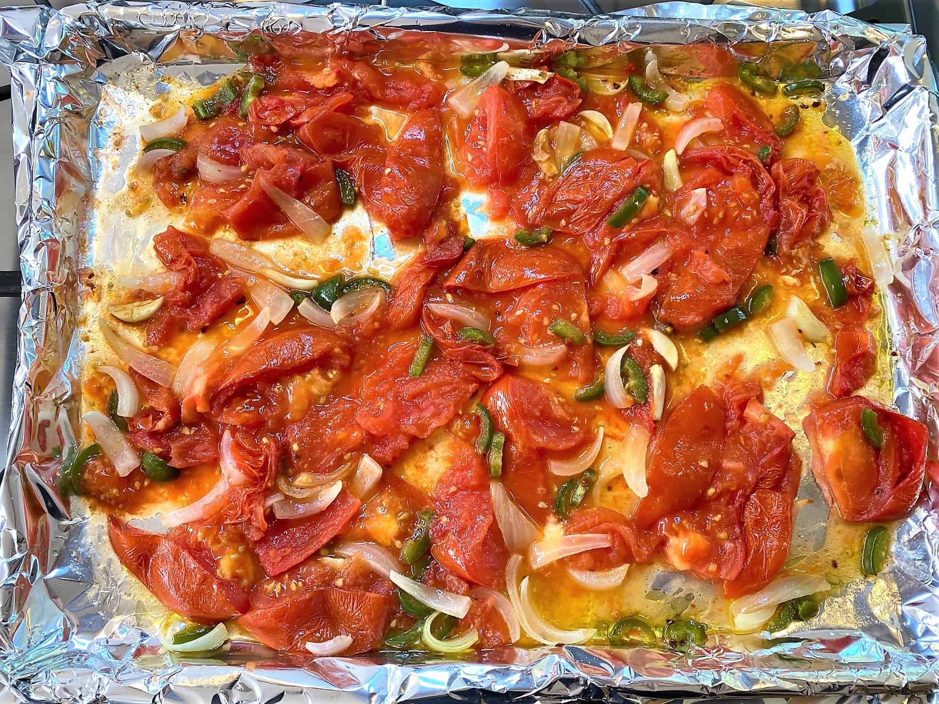 Smashed tomatoes mixed with green peppers, onions, garlic, and seasonings