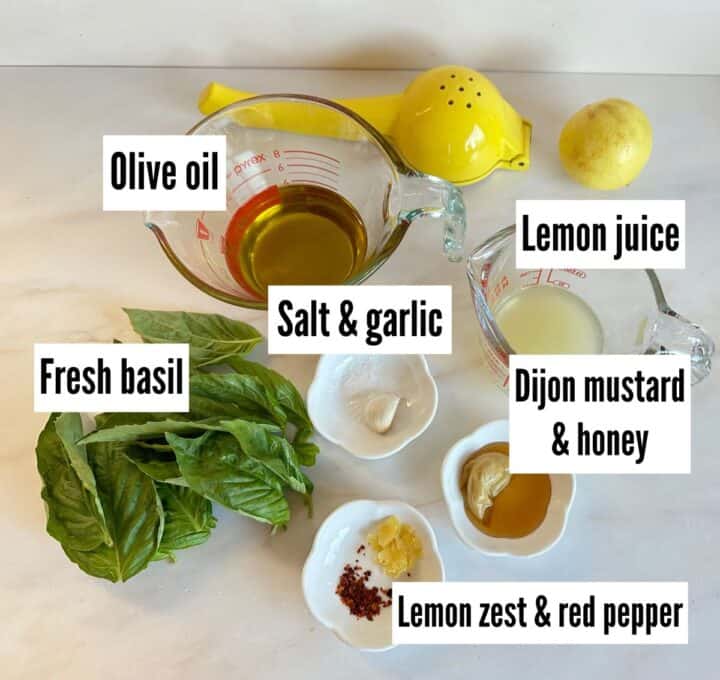 Ingredients for Lemon Basil Vinaigrette with labels on a light background