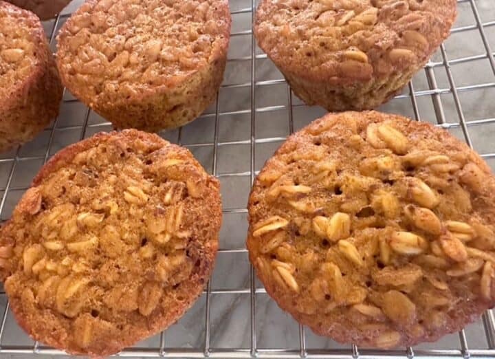 Closeup of Pumpkin Baked Oatmeal Cups showing golden brown muffins with apparent oats in the top