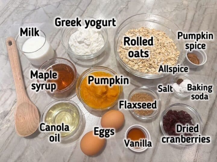 Raw light brown oats, white Greek yogurt, orange pumpkin puree, and other ingredients for Baked Pumpkin oatmeal cups