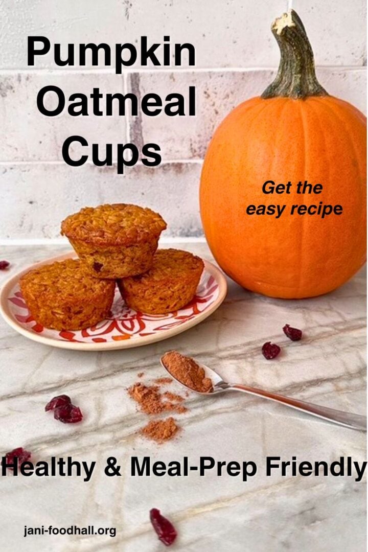 Stack of 3 golden pumpkin baked oatmeal cups on a plate next to an orange pumpkin. 