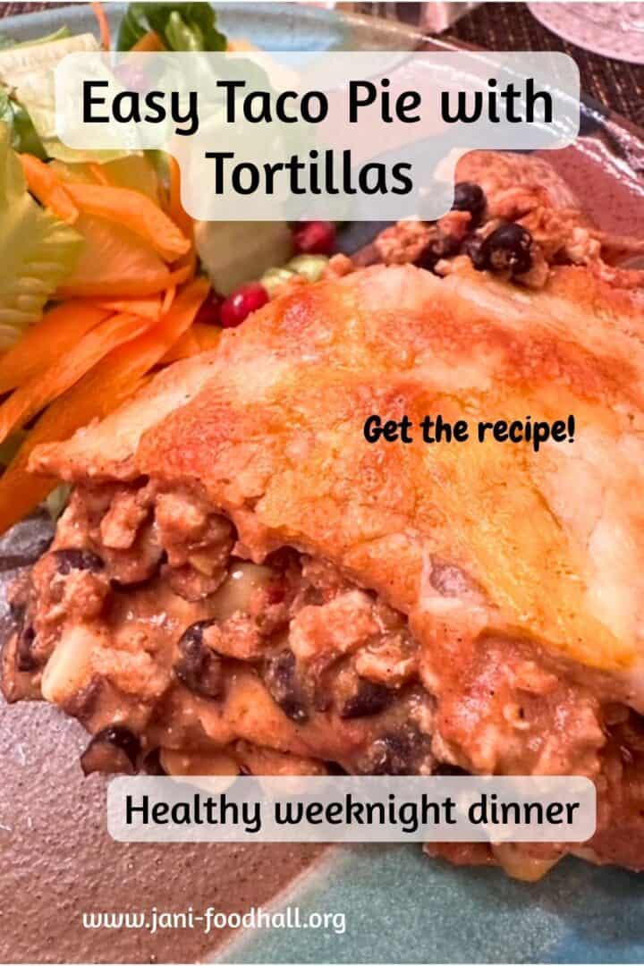 A ground meat, black, bean, and corn filling oozes out between tortilla layers topped with orange, melted cheese.