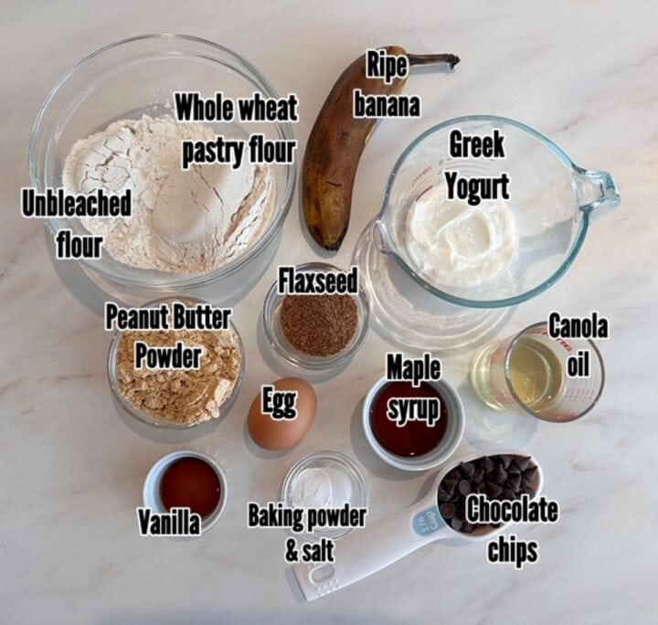 Ripe banana, tan peanut butter powder, white Greek yogurt, dark flaxseed, and other ingredients needed for muffins.