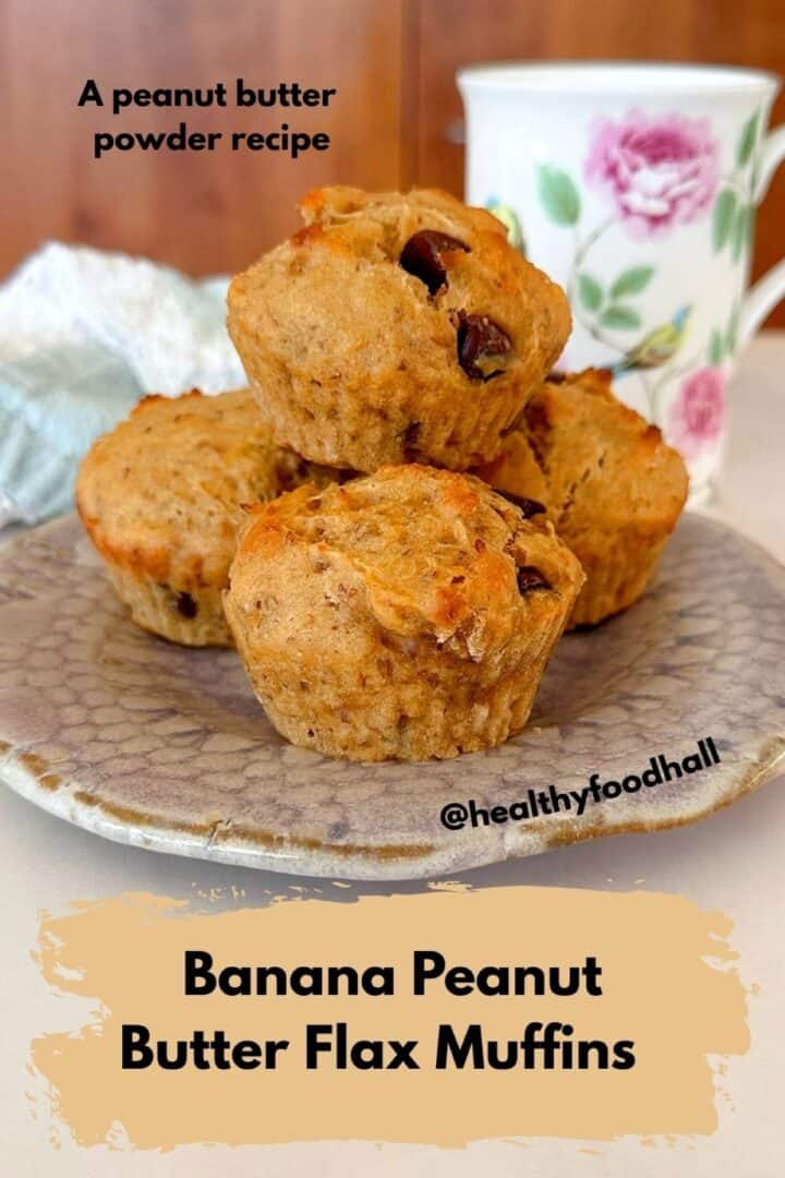 Four golden peanut butter banana chocolate chip muffins on a plate.