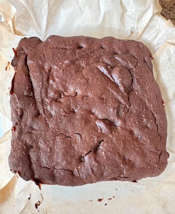 Whole brown chocolate cake of no-sugar brownies, uncut.