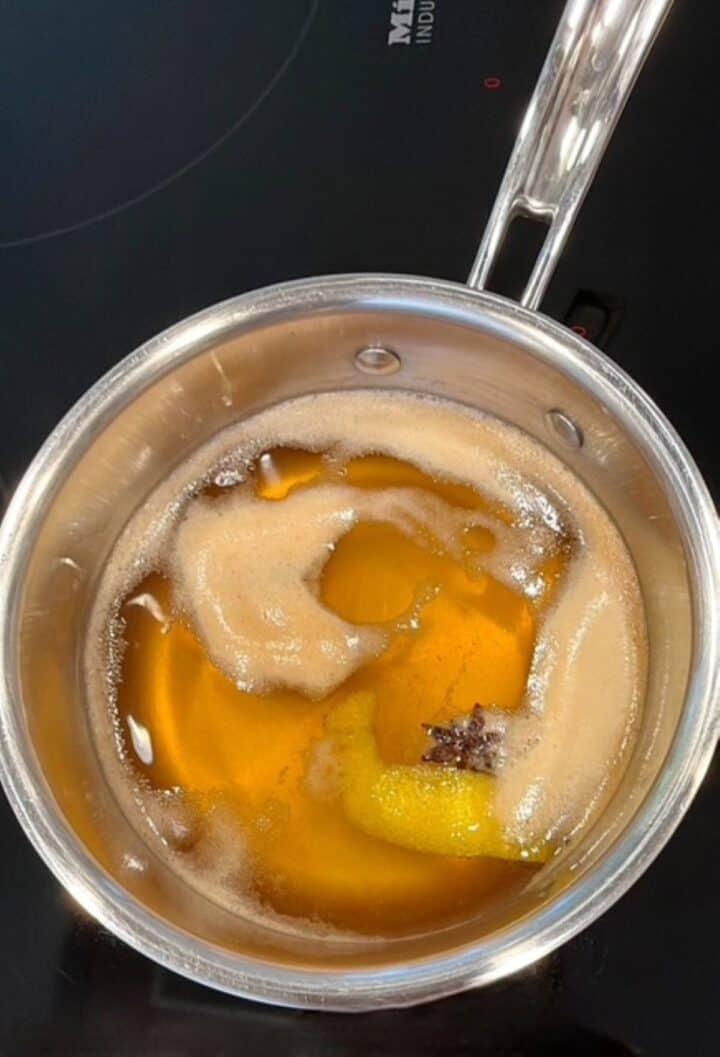 Close-up of brine in a saucepan for sweet and tangy apples.